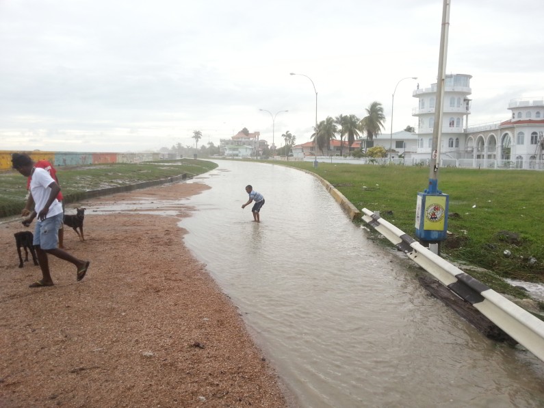 High tide rushes over Seawalls; areas flooded