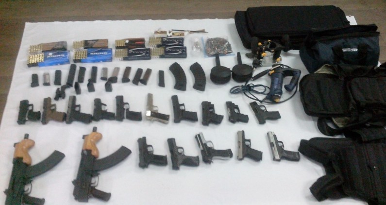 15 hand guns, 2 AK-47 rifles and ammunition found in barrel at city wharf