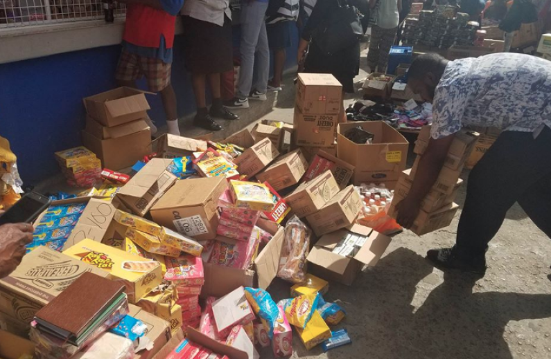 Piles of expired food items seized from Stabroek Market Bazaar during City Council raid