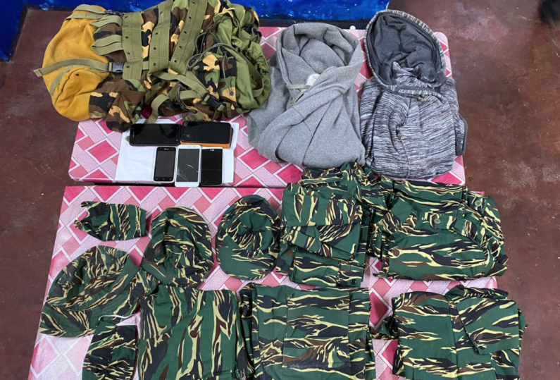 Three Corentyne men in Custody after camouflage outfits and unlicensed weapon found in home