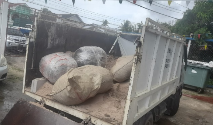 Over 120 pounds of marijuana found in truck under load of sand