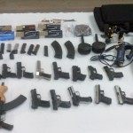 15 hand guns, 2 AK-47 rifles and ammunition found in barrel at city wharf