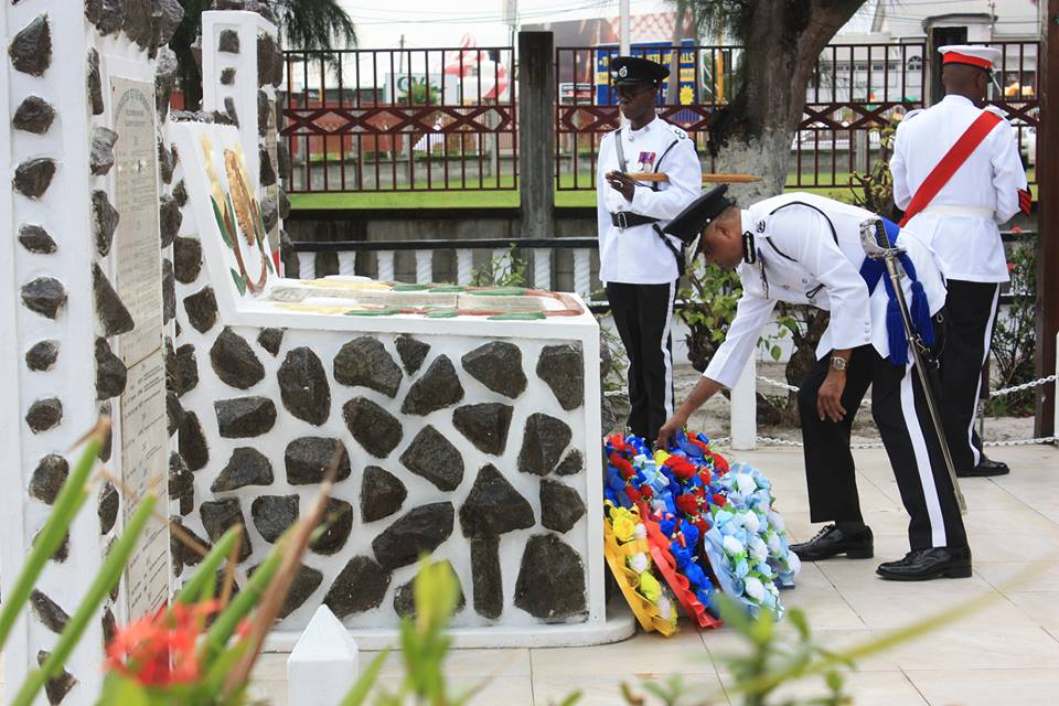 Police Commissioner, Seelall Persaud lays a wreath at the foot of the monument. 
