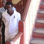 Third accused remanded for Emancipation Day shootout at Police