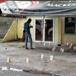 Man riddled to death outside Forshaw St. Hotel; Over 20 spent shells recovered
